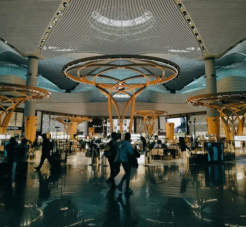Modern airport interior with travelers